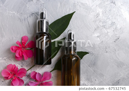 Glass dropper bottles, cosmetic oil package.Copy space for text. Natural care. 67532745