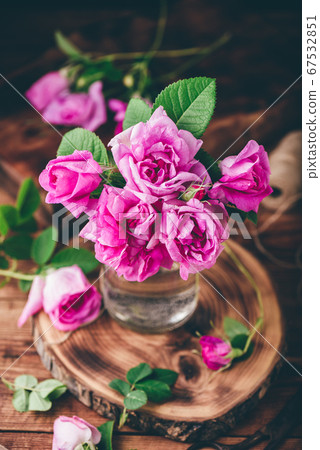 Bouquet of small pink garden roses in jar Bouquet of small pink garden roses in jar 67532851