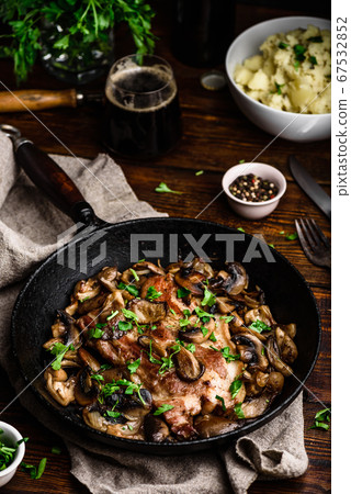 Fried pork neck steak with different mushrooms Fried pork neck steak with different mushrooms 67532852