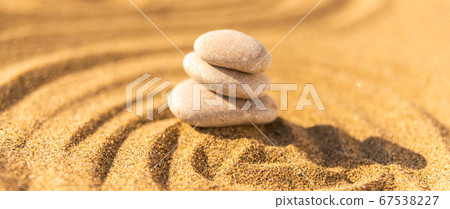 zen meditation stone in sand, concept for purity 67538227