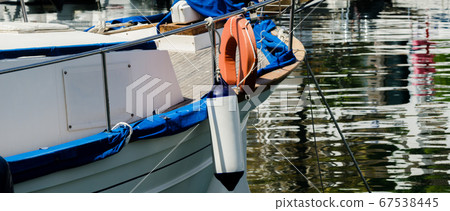 buoy hanging outside the hull of the boat, boat 67538445