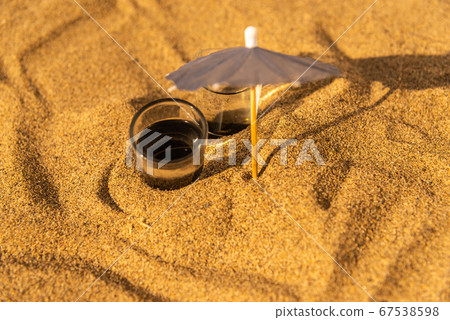 colorful shots drinks on a sandy beach with 67538598