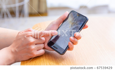 Smartphone with broken screen 16:9 Smartphone with broken screen 16:9 67539429