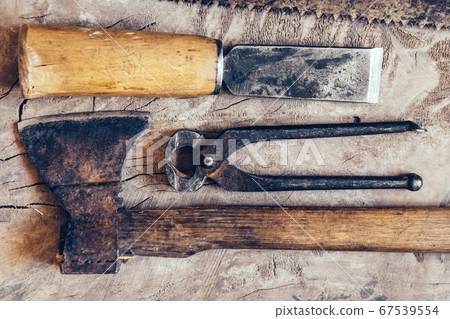 Old construction tools on a wooden workbench flat lay background. Carpenter table. Woodwork Old construction tools on a wooden workbench flat lay background. Carpenter table. Woodwork 67539554