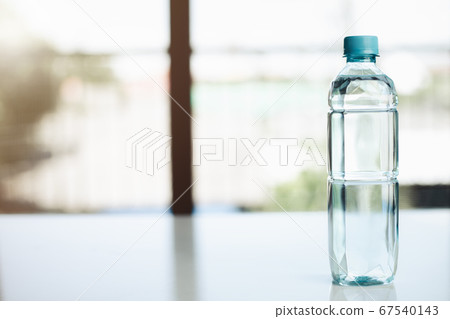 Drinking water bottle on the table Drinking water bottle on the table 67540143