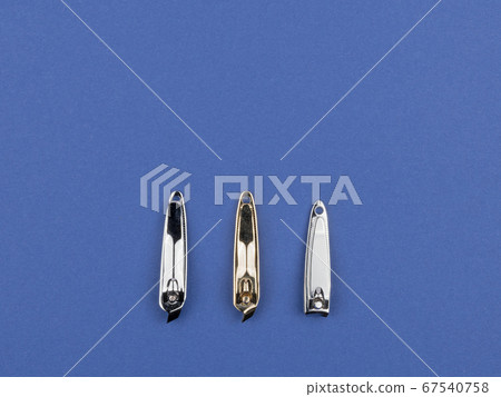 Accessories for manicure and pedicure on a blue 67540758