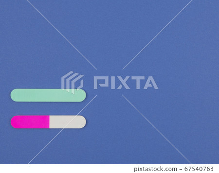 Nail file for nail care on the blue background. 67540763