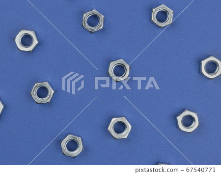 Nuts on blue background close-up. 67540771
