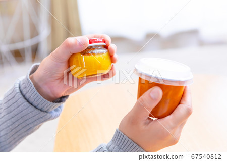Copy space at hand with baby food 67540812