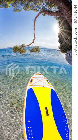 Colorful paddle board against azure sea in Brela, Croatia 67541644