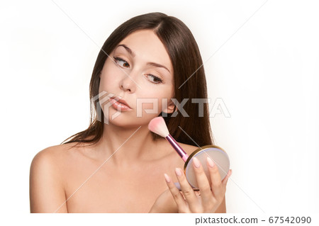 Young girl makeup. Pink brush and mirror. Salon beauty apply mascara 67542090
