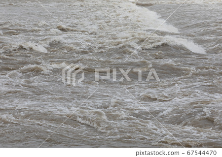 Guerrilla brown muddy river after heavy rain 67544470