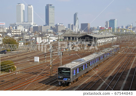 Aonami Line 1000 type Meieki building group in the back Aonami Line 1000 type Meieki building group in the back 67544843