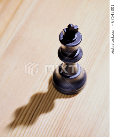 Single King Chess Piece On wooden Background 67545801