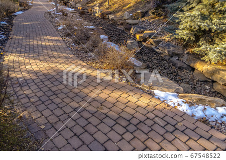Curvy brick pathway on a park in Provo Utah 67548522