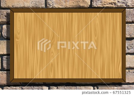 New woodgrain board hung on a brick wall 67551325