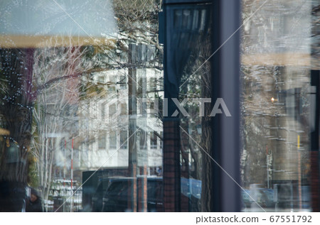 City reflected in glass 67551792