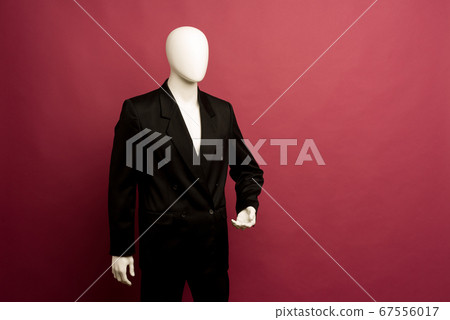 White male mannequin in a black business suit on a 67556017