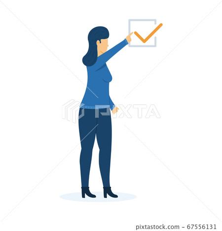 Young girl points a finger at a check mark in a Young girl points a finger at a check mark in a 67556131