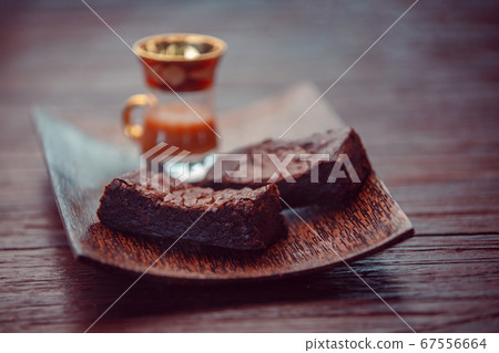 Caramel brownie dessert bars on rustic dark 67556664