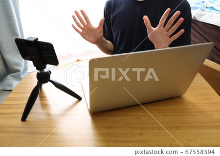People who wave their hands on the screen Telework People who wave their hands on the screen Telework 67558394