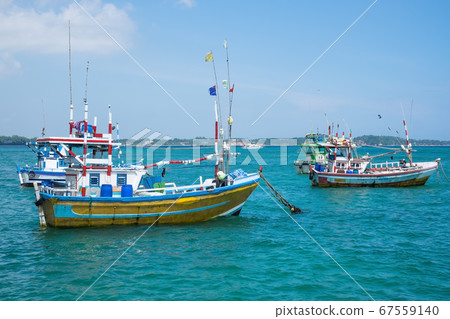 Several traditional local boats to catch fish  67559140
