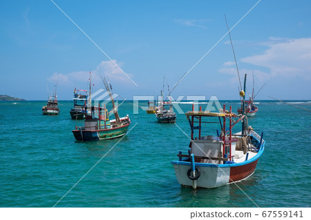 Several traditional local boats to catch fish  67559141