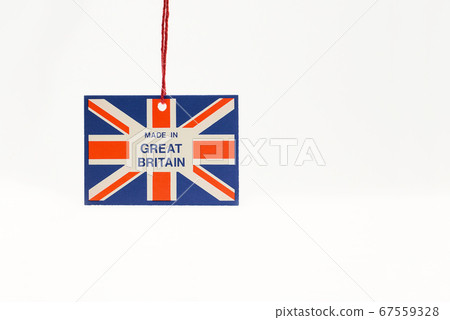 Cardboard tag on a string with a flag and the inscription made in great Britain.  67559328