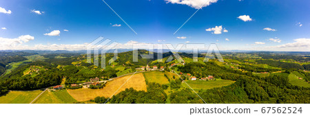 Aerial panorama of of green hills and vineyards Aerial panorama of of green hills and vineyards 67562524