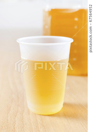 Tea in a plastic cup 67564952