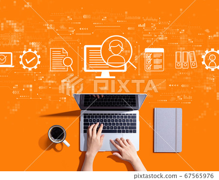 Document management system concept with person using a laptop Document management system concept with person using a laptop 67565976