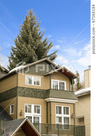 Exterior view of a house with balcony and snow Exterior view of a house with balcony and snow 67568184