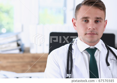 Male medicine doctor hands crossed on his chest 67570385