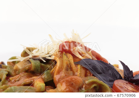 Fragment of pasta tagliatelle with tomato sauce. Fragment of pasta tagliatelle with tomato sauce. 67570906
