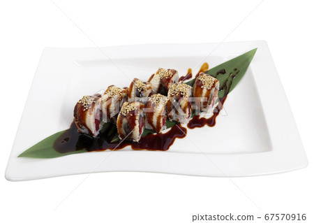 Golden dragon sushi roll with tuna and eel. 67570916