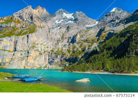 Fantastic alpine lake with high mountains and glaciers, Oeschinensee, Switzerland 67573114