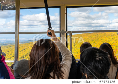 Hakkoda Ropeway Inside the moving gondola Congestion of people 67573326