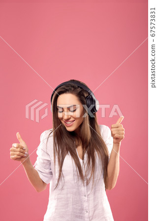 Portrait of caucasian pretty woman listening to Portrait of caucasian pretty woman listening to 67573831