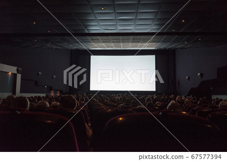 Empty cinema screen with audience Empty cinema screen with audience 67577394