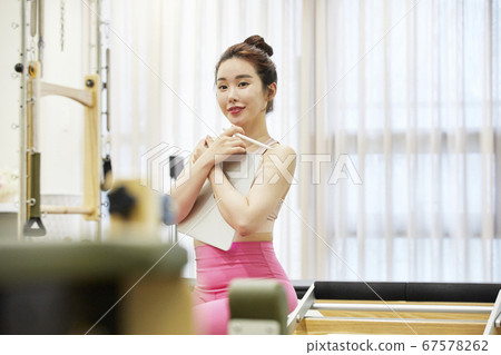 Young woman,exercise,pilates,sport Young woman,exercise,pilates,sport 67578262