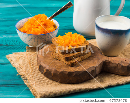 Home made carrot jam on toasted bread 67578478