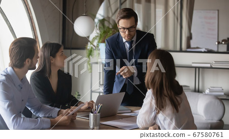 Multiracial businesspeople work together at office briefing Multiracial businesspeople work together at office briefing 67580761