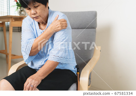 neck and shoulder pain, old woman suffering from neck and shoulder injury, health problem concept 67581334