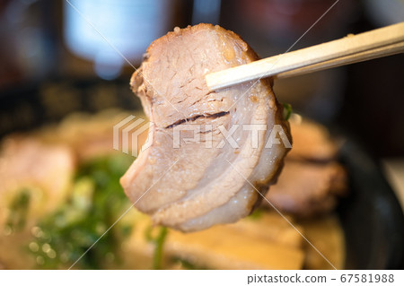 chopsticks pork isolated on ramen background 67581988