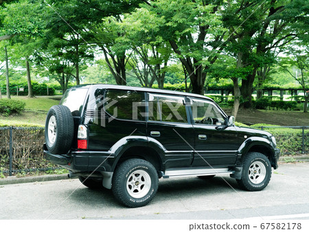 Four-wheel drive vehicle in the forest Four-wheel drive vehicle in the forest 67582178
