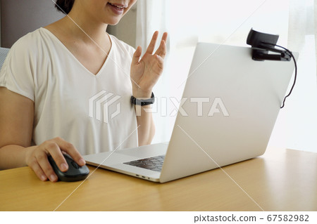 Woman talking on a video call 67582982