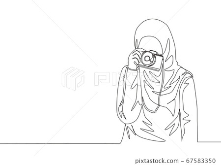 One continuous line drawing of young pretty happy muslimah with headscarf hold camera on hand One continuous line drawing of young pretty happy muslimah with headscarf hold camera on hand 67583350