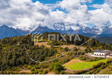 Meili snow mountain in background in Deqen, Shangri-la country,  Yunnan province, China 67584859
