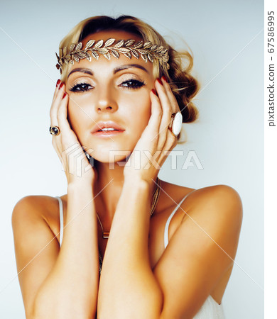 young blond woman dressed like ancient greek godess, gold jewelry close up isolated, summer trends young blond woman dressed like ancient greek godess, gold jewelry close up isolated, summer trends 67586995