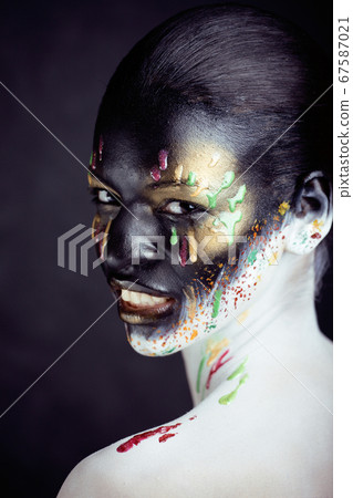 woman with creative makeup closeup like drops of colors, facepaint close up halloween woman with creative makeup closeup like drops of colors, facepaint close up halloween 67587021